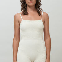 hakea textured cream Terrain One Piece shorty surfsuit — sustainable swimwear designed for support and comfort in the surf, flattering one piece surf suit for active women.