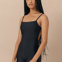 hakea black Terrain One Piece shorty surfsuit — sustainable swimwear designed for support and comfort in the surf, flattering one piece surf suit for active women.